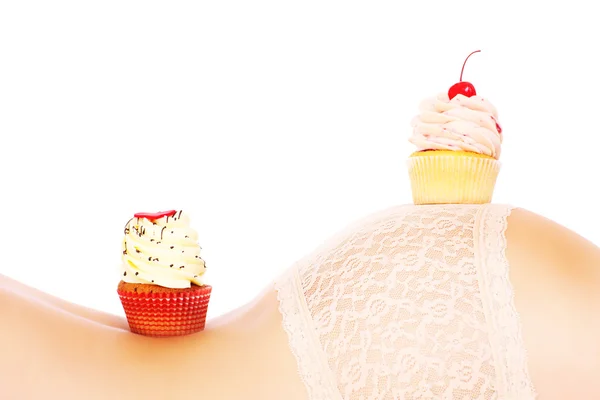 Cupcakes on a body — Stock Photo, Image