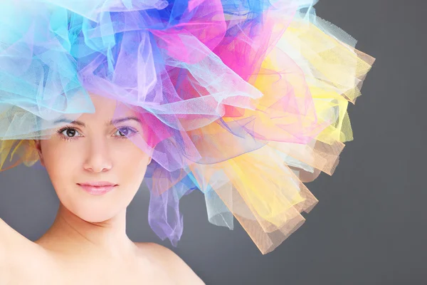 Woman in a rainbow hat — Stock Photo, Image