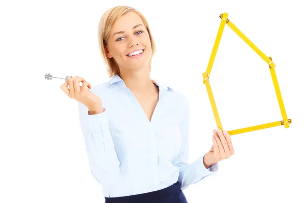 Real estate agent with keys and measure — Stock Photo, Image