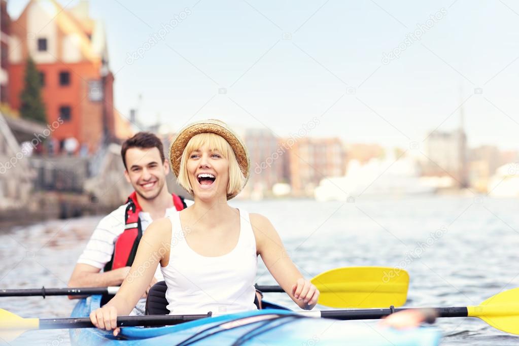 Happy tourists in a canoe