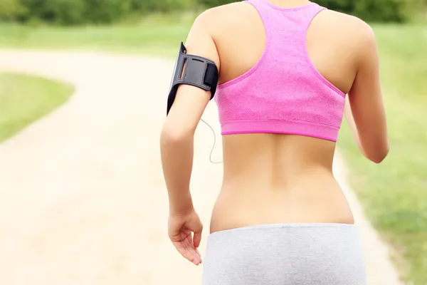 Back of running woman — Stock Photo, Image