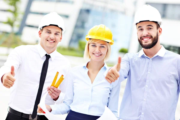 Group of happy architects on site — Stock Photo, Image