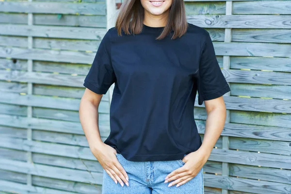 Young woman in black shirt