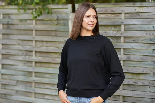 Young woman in black blouse — Stock Photo, Image