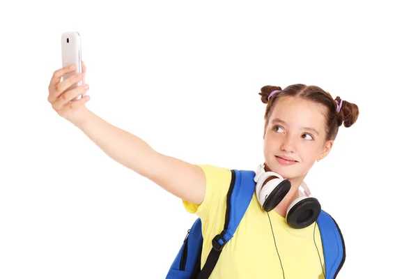 Koulutyttö ottaa kuvia älypuhelimellaan — kuvapankkivalokuva