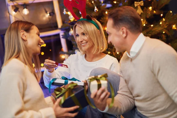 Friends or family celebrating christmas party — Stock Photo, Image