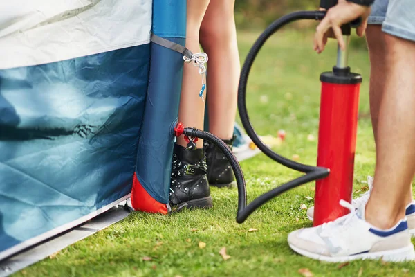 Young nice couple having fun on camping setting up tent — Foto Stock