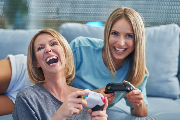 Two girl friends or lgbt couple in living room — Stock Photo, Image