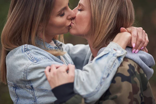 Two girl friends or lgnt couple in wood — Stock Photo, Image