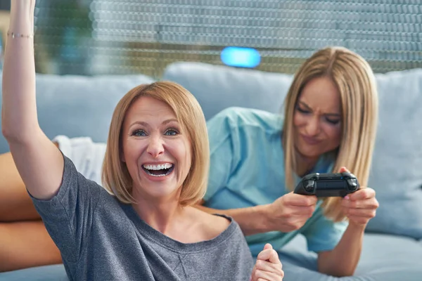 Two girl friends or lgbt couple in living room — Stock Photo, Image