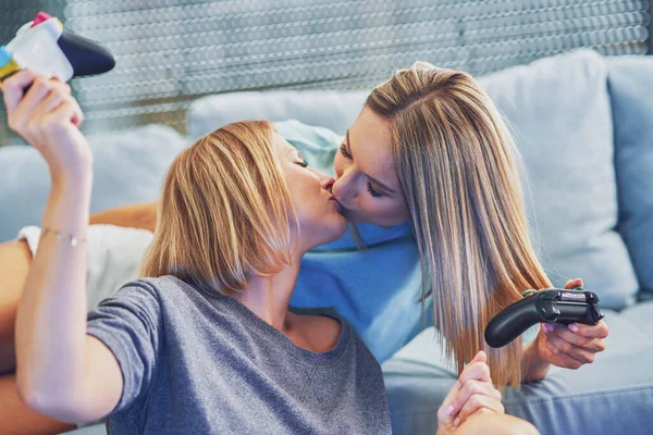 Two girl friends or lgbt couple in living room — Stock Photo, Image