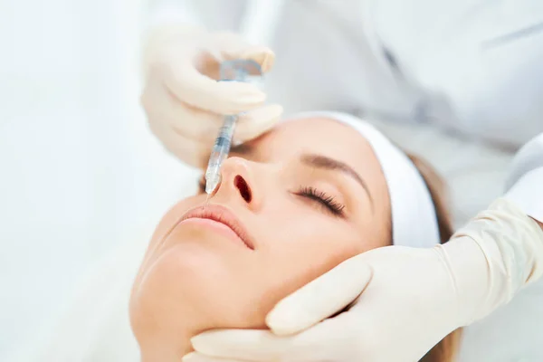 A scene of medical cosmetology treatments botox injection. — стоковое фото