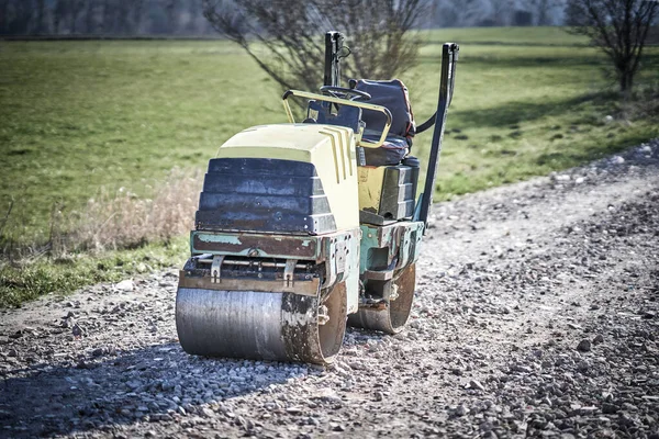 Picture of a road roller machine on the different surfaces — 스톡 사진