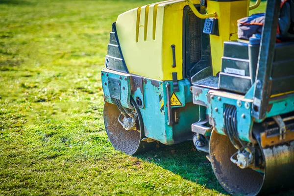 Picture of a road roller machine on the different surfaces — Stockfoto