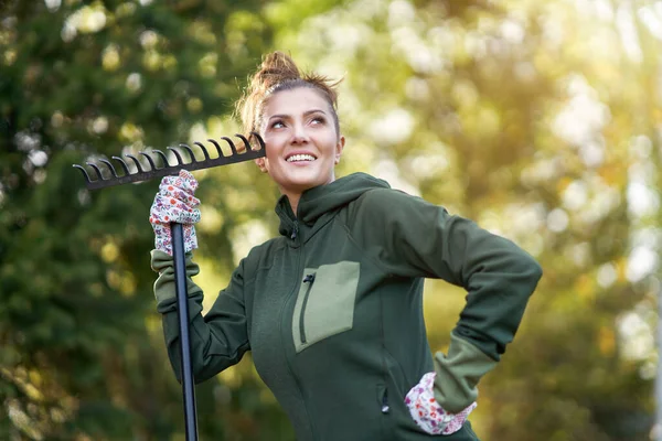 Young Happy woman with garden tools working — Stock Photo, Image