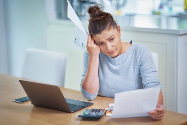 Young woman counting home budget with bills. High quality photo