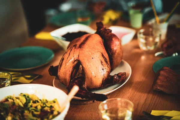 Thanksgiving dinner cooked turkey on wooden table. High quality photo