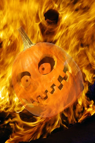 Halloween Pumpkins. Halloween pumpkin in party mood. Jack O Lantern. Isolated on white. Room for text. Halloween pumpkin on fire. Fiery red hot Halloween jack o lantern. Pumpkin carved with scary evil face glowing brightly with thick smoke. Hell Fire