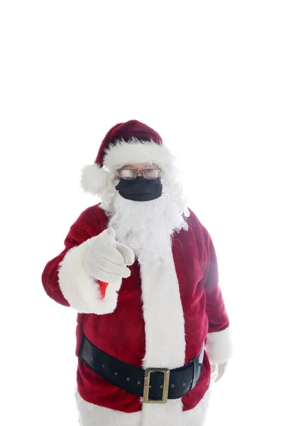 サンタはマスクを着用すると言います サンタクロースは コロナウイルスの感染を防ぐために医療面マスクを着用しています 白に隔離されてる テキスト用の部屋 Covid 19は危険です Covid 19クリスマス フェイスマスクは — ストック写真