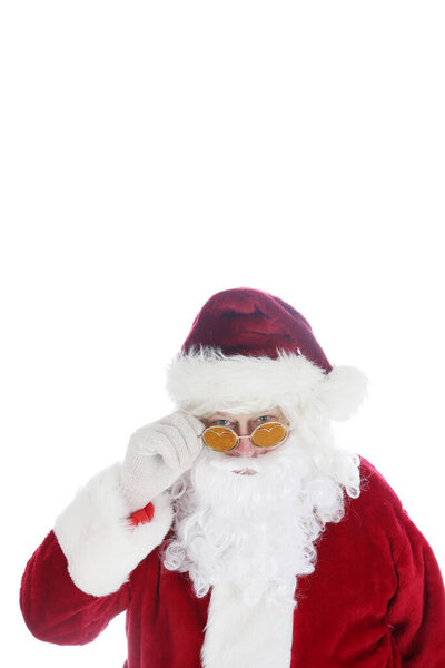 Santa Claus wearing costume and sunglasses. Christmas. Happy Holidays. Santa Claus. Fashion. Santa Claus Christmas. Santa wears his Sunglasses. Room for text. Santa is cool in his hip sunglasses. Merry Christmas to all. Happy Holidays. 