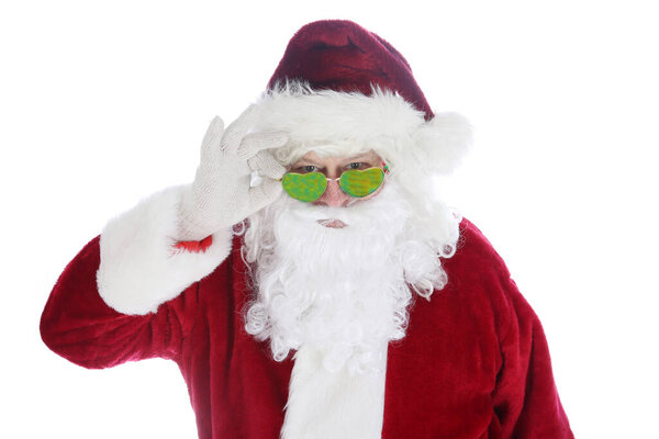 Santa Claus wearing costume and sunglasses. Christmas. Happy Holidays. Santa Claus. Fashion. Santa Claus Christmas. Santa wears his Sunglasses. Room for text. Santa is cool in his hip sunglasses. Merry Christmas to all. Happy Holidays. 