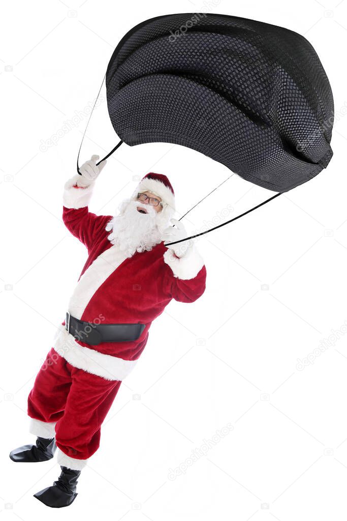 Santa Claus Parachute's with a Covid-19 Face Mask.  Christmas Humor. Isolated on white. Santa Claus uses a Coronavirus Face Mask for a parachute. Merry Christmas. Santa Claus skydiver with a Parachute