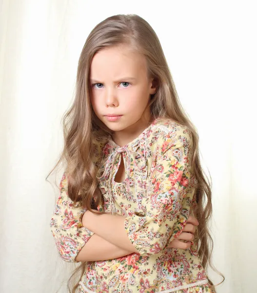 Little blond girl sends air kiss and blowing — Stock Photo, Image