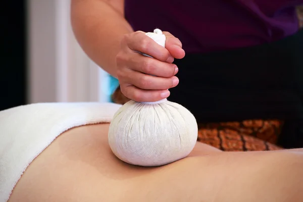 Massage with spa herbal compress balls — Stock Photo, Image
