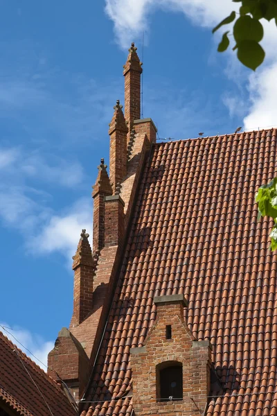 Roof tiles and decorations in Malbork — Stock Photo, Image
