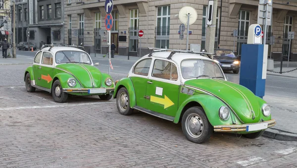 Two green antique car — Stock Photo, Image