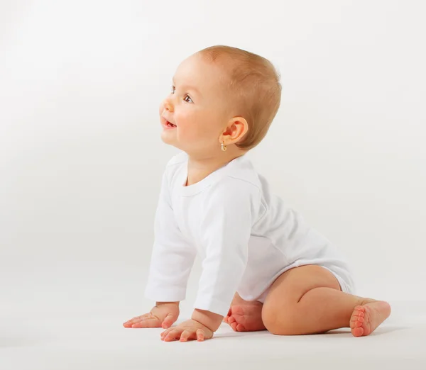 Cute 4 month old baby girl looking above — Stock Photo, Image