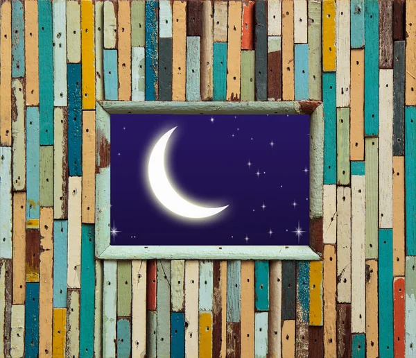 Parede de madeira colorida velha com lua e estrela — Fotografia de Stock
