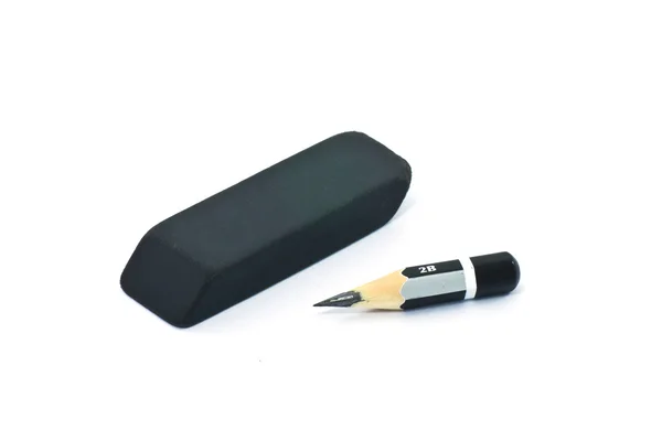 Very short pencil and a black rubber — Stock Photo, Image