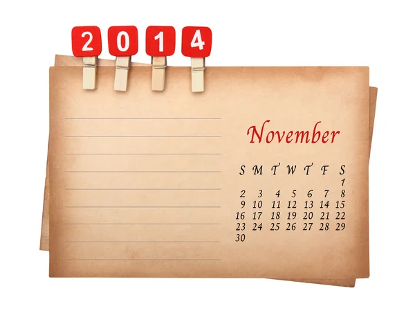 Calendar 2014 on the old paper with wooden pegs — Stock Photo, Image