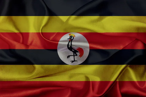 Uganda grunge viftande flagga — Stockfoto