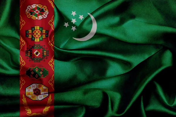 Turkmenistan bandiera sventolante grunge — Foto Stock