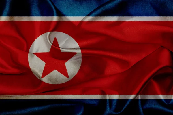 Nordkoreas Grunge schwenkt Flagge — Stockfoto