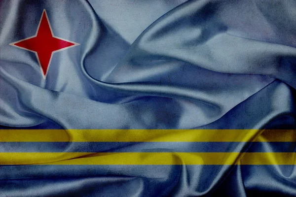 Aruba grunge viftande flagga — Stockfoto
