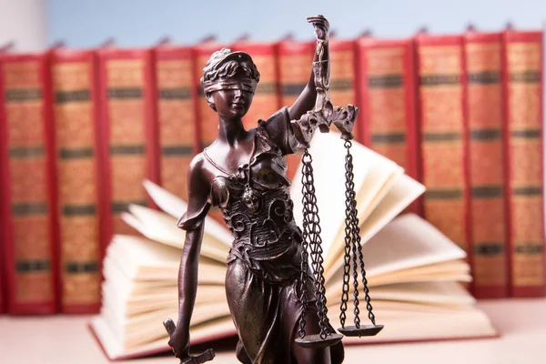 Law concept - Open law book with a wooden judges gavel on table in a courtroom or law enforcement office isolated on white background. Copy space for text