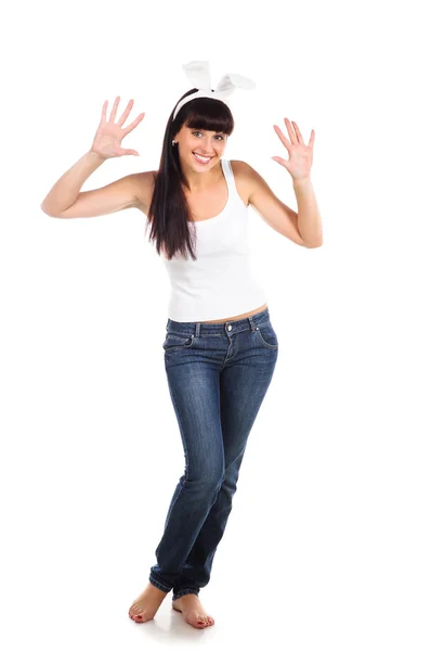 Playful adult girl wearing bunny ears isolated over white — Stock Photo, Image