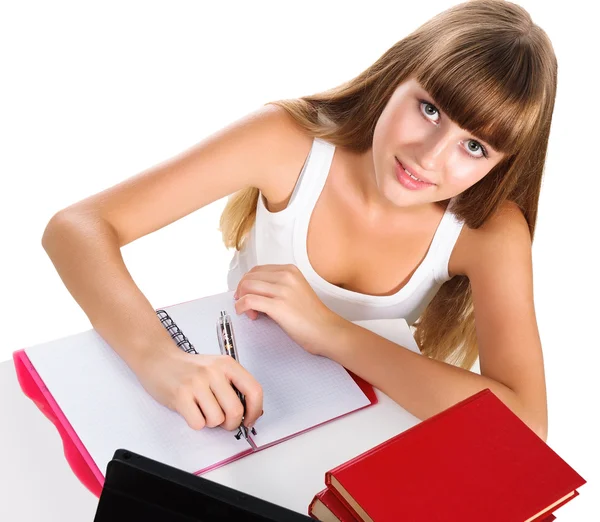 Linda chica adolescente educación en casa con libros y tabletas aislados sobre — Foto de Stock