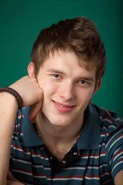 Young guy on a green background Stock Picture
