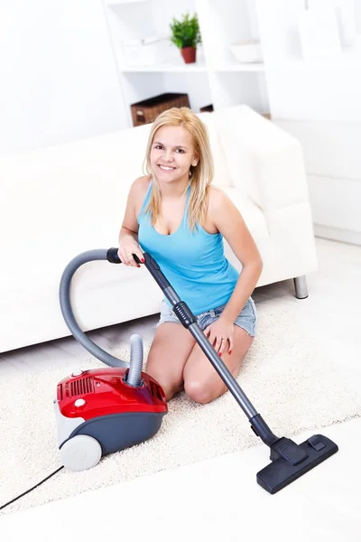 Sexi woman using vacuum cleaner — Stock Photo, Image