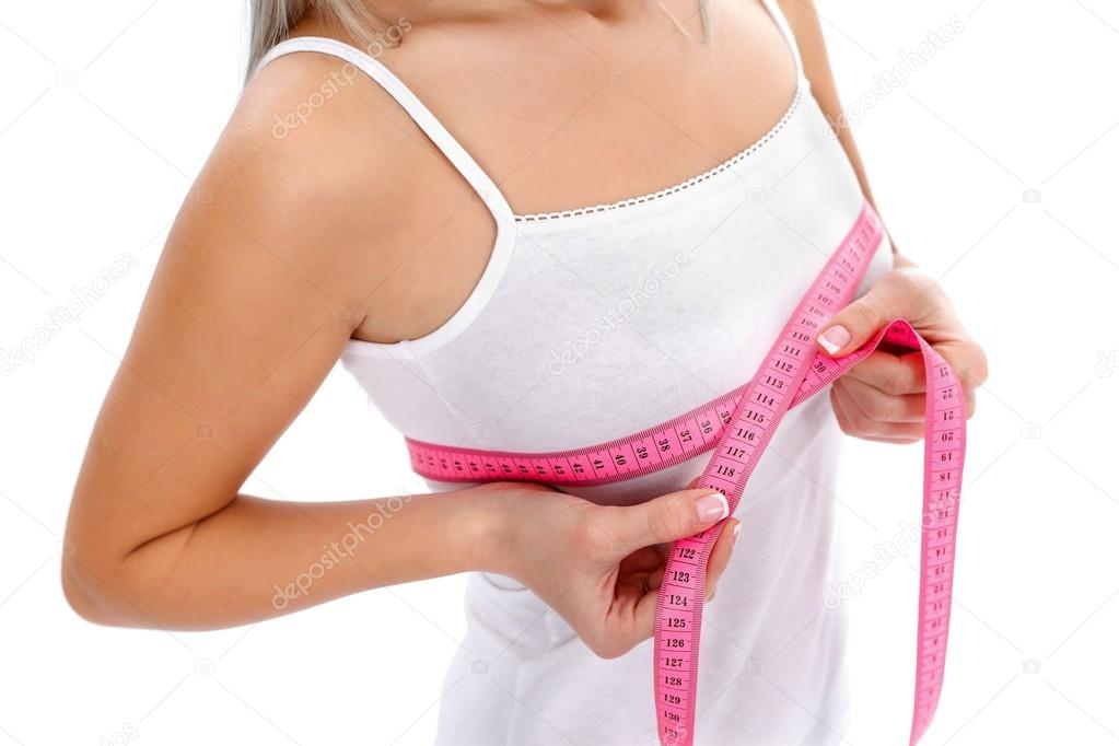 Woman measuring breast