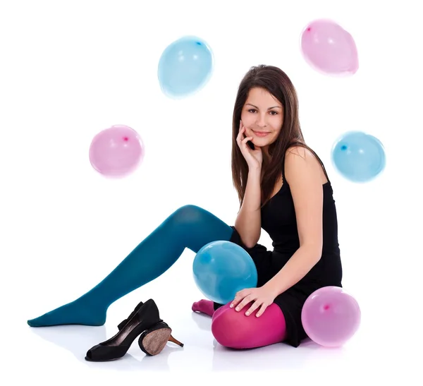 Girl with balloons on the floor — Stock Photo, Image