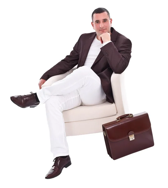 Hombre de negocios guapo sentado en sillón — Foto de Stock