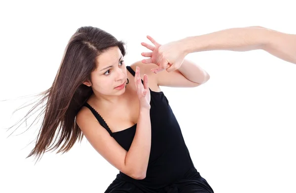 Teenage girl afraid of a hand hitting her — Stock Photo, Image