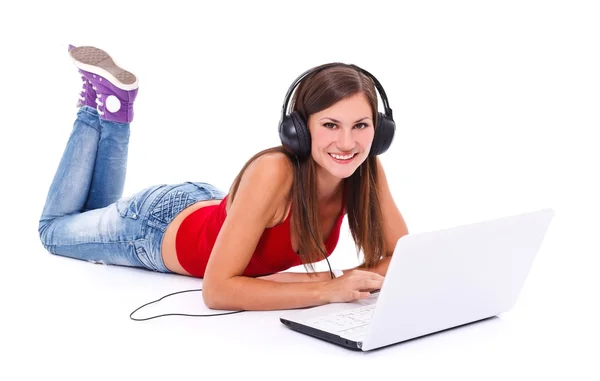 Girl in headphone with laptop — Stock Photo, Image