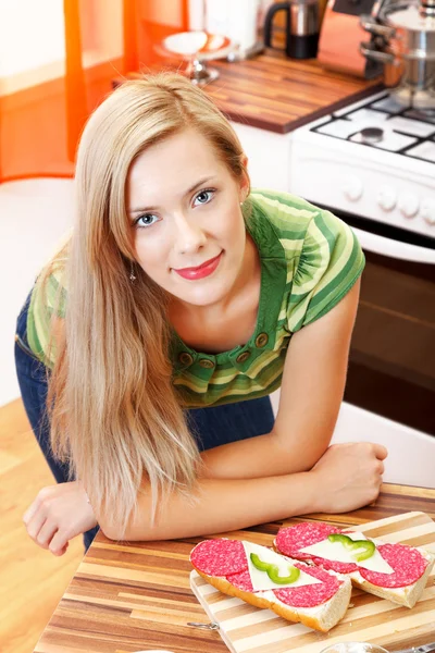 Smiling beauty with sandwiches — Stock Photo, Image