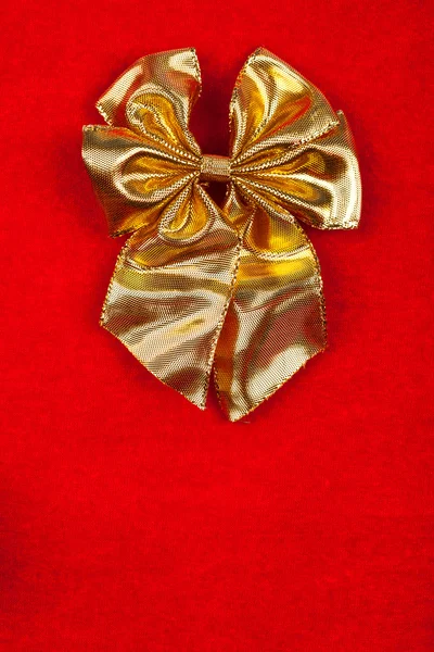 Golden ribbon on velvet background — Stock Photo, Image